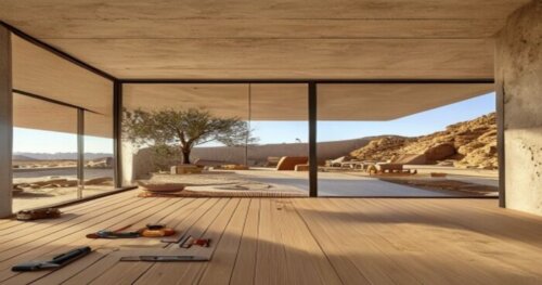A realistic photo of a modern desert house interior with large windows, showing vinyl flooring installation over underfloor heating system, with visible thermal mass walls (Trombe walls) in the backgr