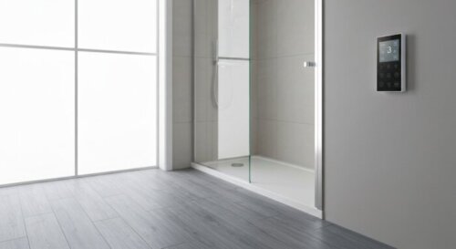 A small modern bathroom with a walk-in shower, a frameless glass shower screen, luxury vinyl plank flooring, and underfloor heating thermostat on the wall. Realistic, bright, clean, no text.